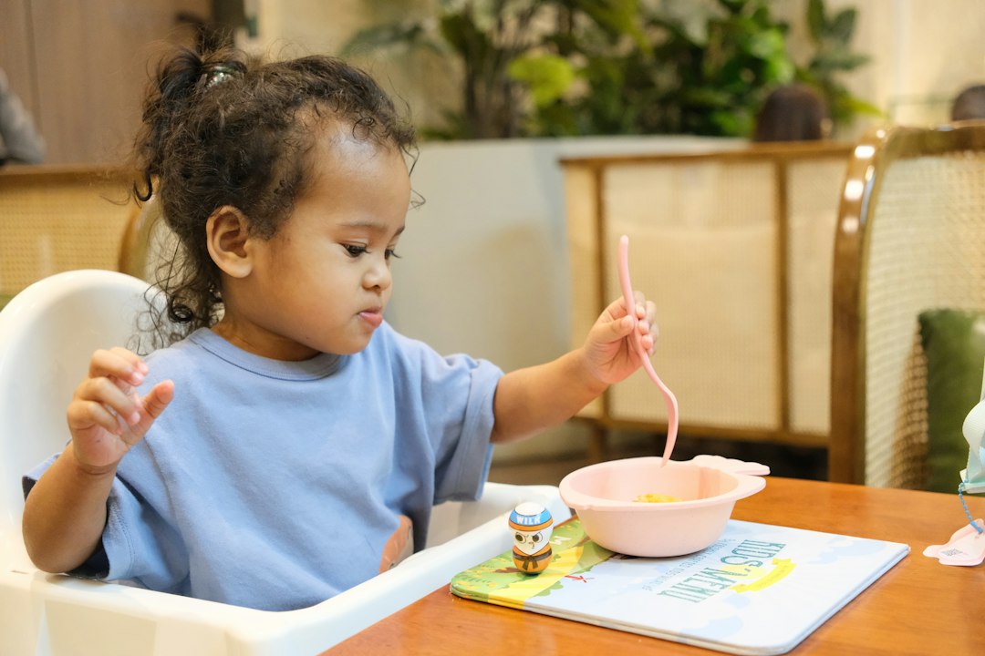 Young child eating at a table representing feeding therapy support